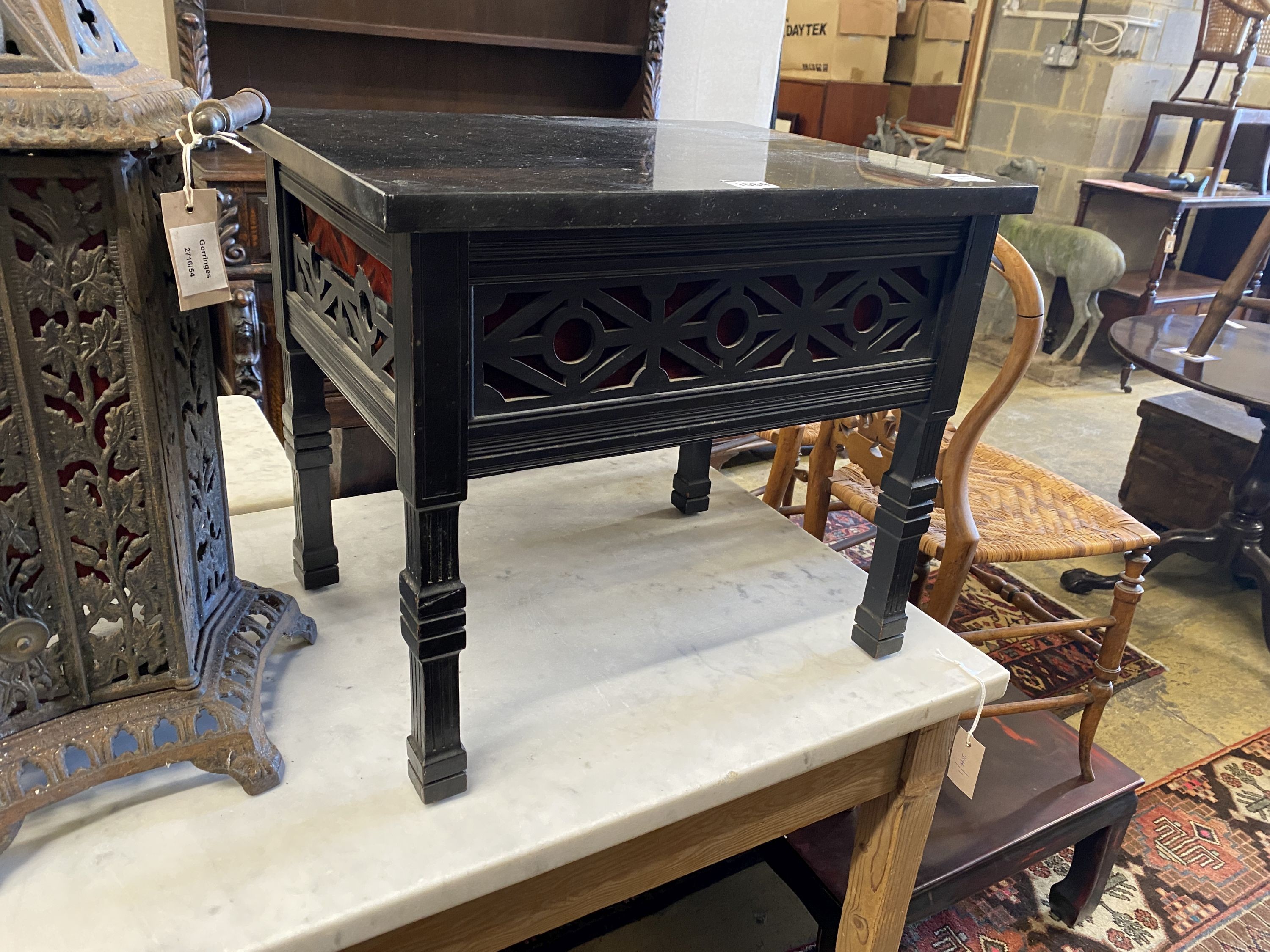 A late Victorian fret cut ebonised marble-topped occasional table, adapted, width 52cm, depth 40cm, height 45cm